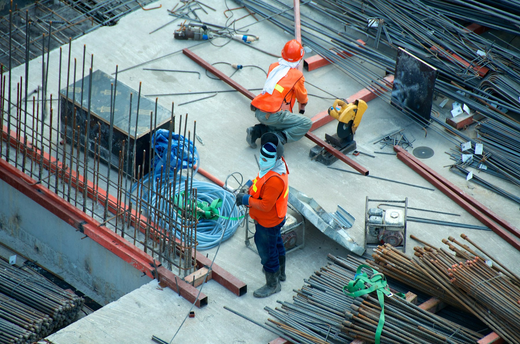 Construction professionals preparing structural works on a building site
